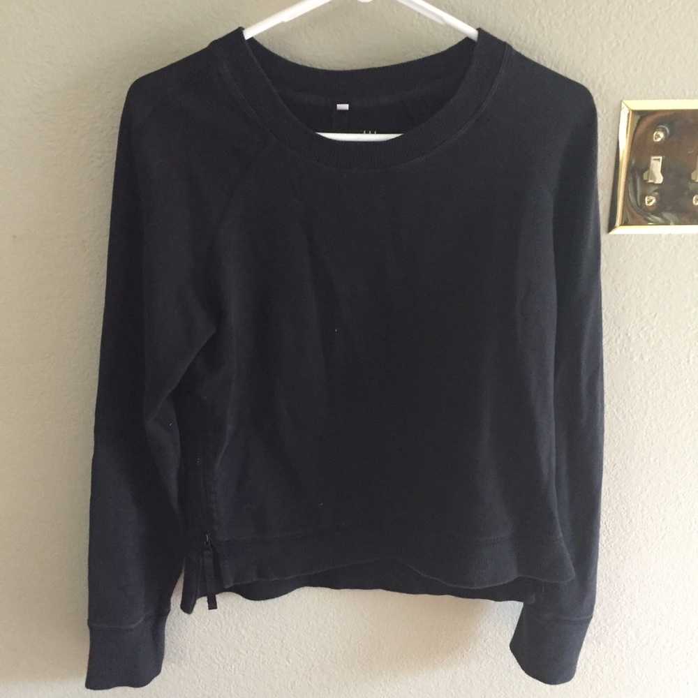 Lululemon athletic jacket with zippers.